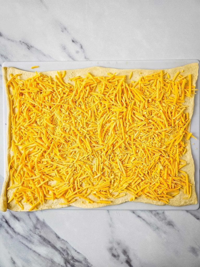 Cheese spread over crescent dough.