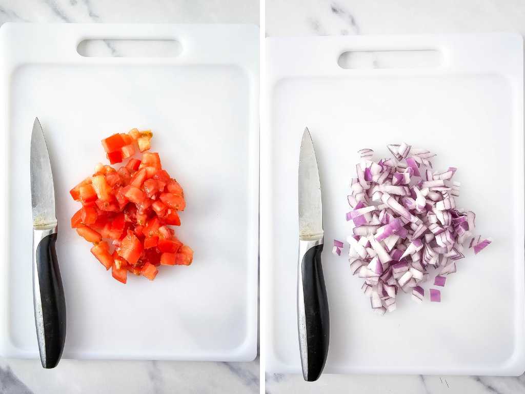 Diced tomato and onion, knives on cutting boards.