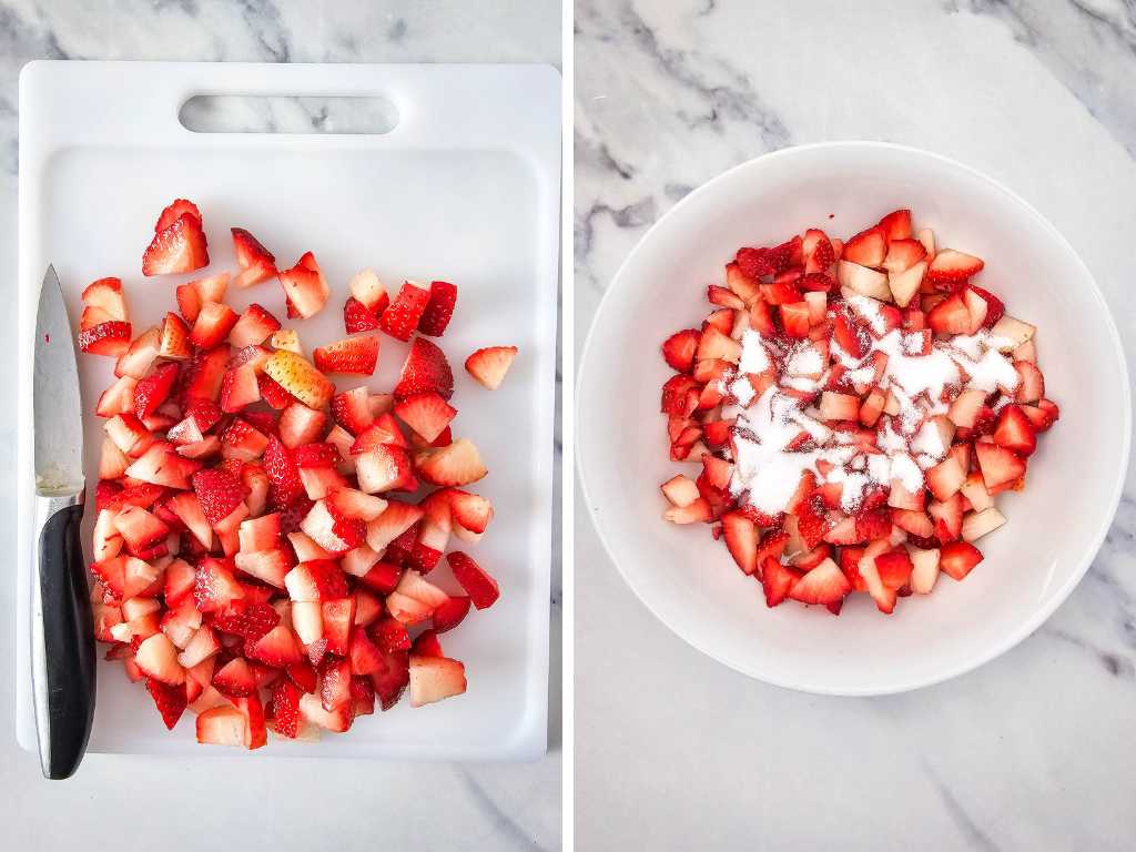 Cut strawberries on a cutting board and bowl.
