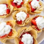 Strawberry shortcake pie bites on a white serving platter.