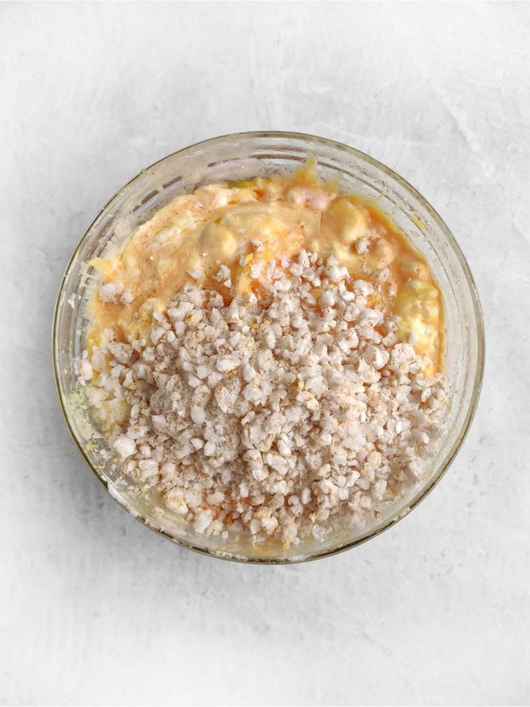 Rice crispy, melted marshmallow and butter in a bowl.