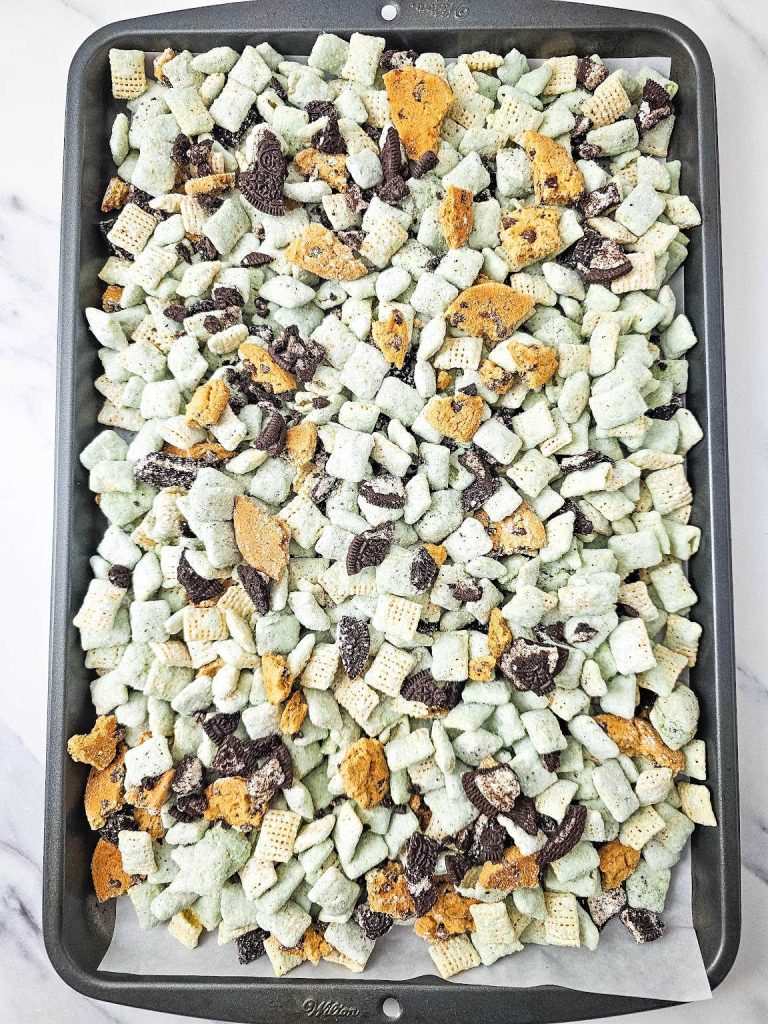 Cookie Monster puppy chow on a baking sheet.