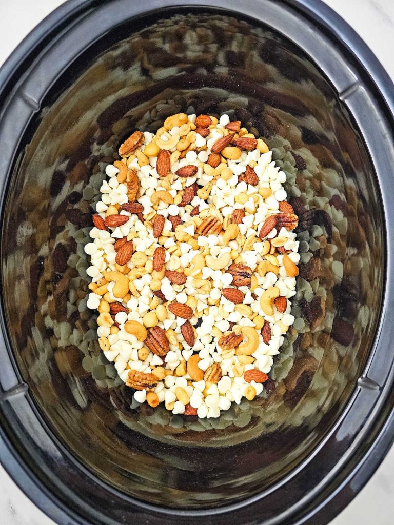 Nuts and white chocolate in a crockpot.