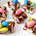 Easter rocky road candies on a white tray.
