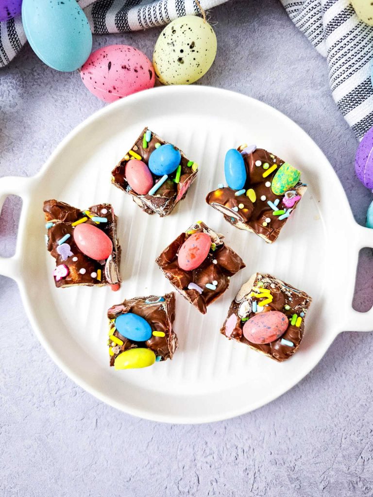 Easter rocky road bars on a white platter.
