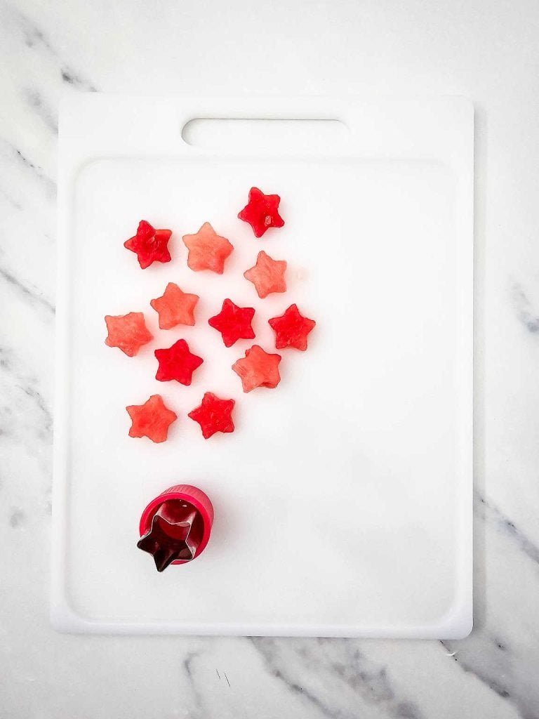 Red white and blue fruit skewers process 1